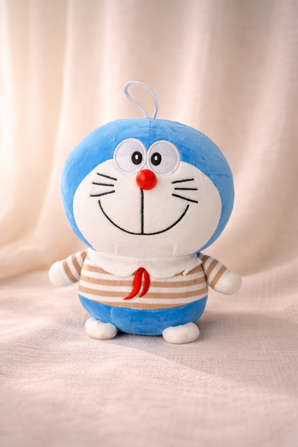 SugarPlum Doraemon Plush Toy – Soft & Huggable Cartoon Teddy (25 cm)
